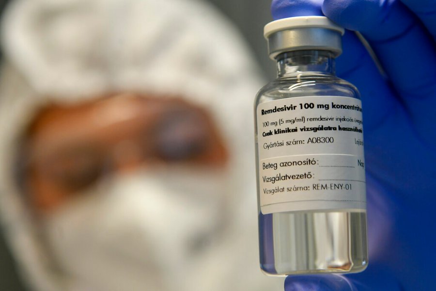 A bottle containing the drug Remdesivir is shown by a health worker at the Institute of Infectology of Kenezy Gyula Teaching Hospital of the University of Debrecen in Debrecen, Hungary on Oct. 15, 2020. (Zsolt Czegledi/MTI via AP)