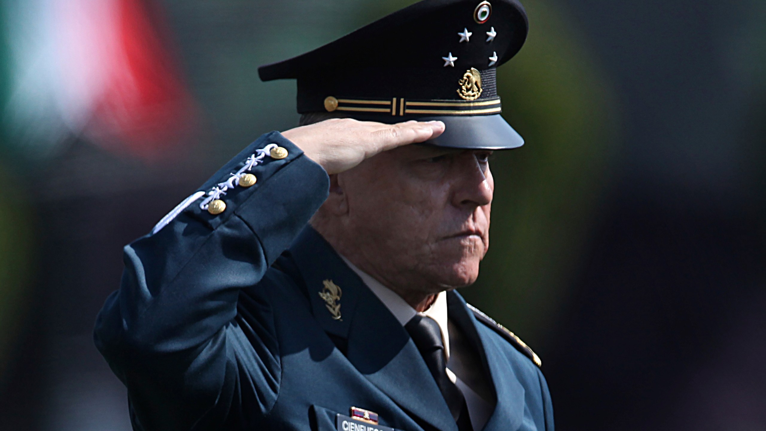 In this April 16, 2016 file photo, Mexico's Defense Secretary Gen. Salvador Cienfuegos Zepeda salutes soldiers at the Number 1 military camp in Mexico City. Mexico's Foreign Relations Secretary Marcelo Ebrard wrote in his Twitter account Thursday, Oct. 15, 2020, that U.S. Ambassador Christopher Landau had informed him that Gen. Cienfuegos has been arrested in Los Angeles. (AP Photo/Marco Ugarte, File)