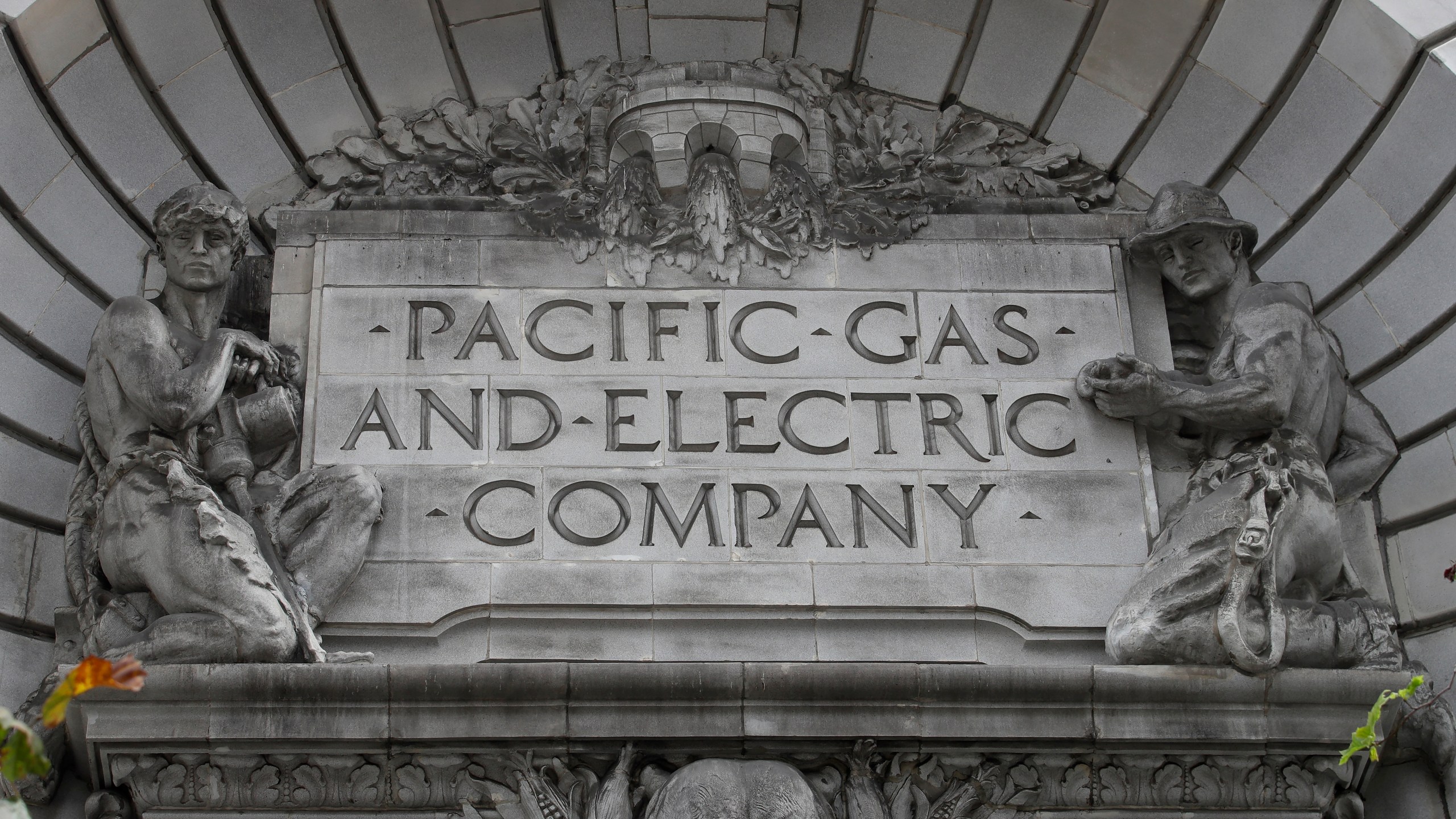 In this April 16, 2020, file photo, a Pacific Gas & Electric sign is displayed on the exterior of a PG&E building in San Francisco. (AP Photo/Jeff Chiu, File)