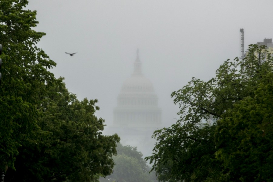 In this May 22, 2020, file photo the Dome of the U.S. Capitol Building is visible through heavy fog in Washington. (AP Photo/Andrew Harnik, File)