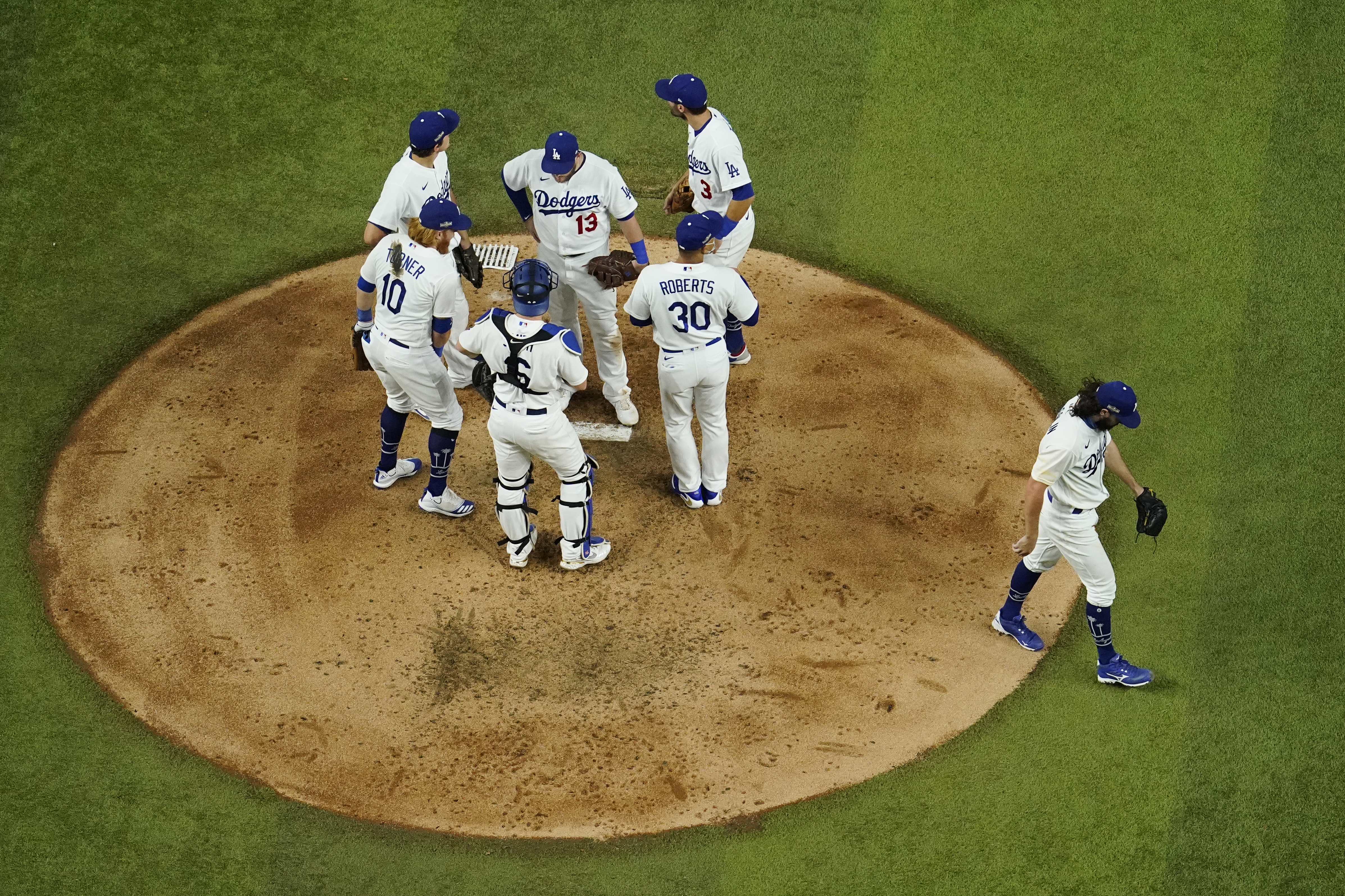 Los Angeles Dodgers starting pitcher Tony Gonsolin leaves the game against the Atlanta Braves during the fourth inning in Game 7 of a baseball National League Championship Series on Oct. 18, 2020, in Arlington, Texas. (David J. Phillip / Associated Press)