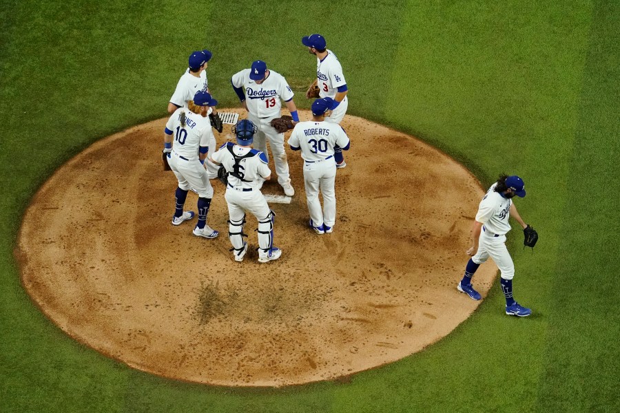 Los Angeles Dodgers starting pitcher Tony Gonsolin leaves the game against the Atlanta Braves during the fourth inning in Game 7 of a baseball National League Championship Series on Oct. 18, 2020, in Arlington, Texas. (David J. Phillip / Associated Press)