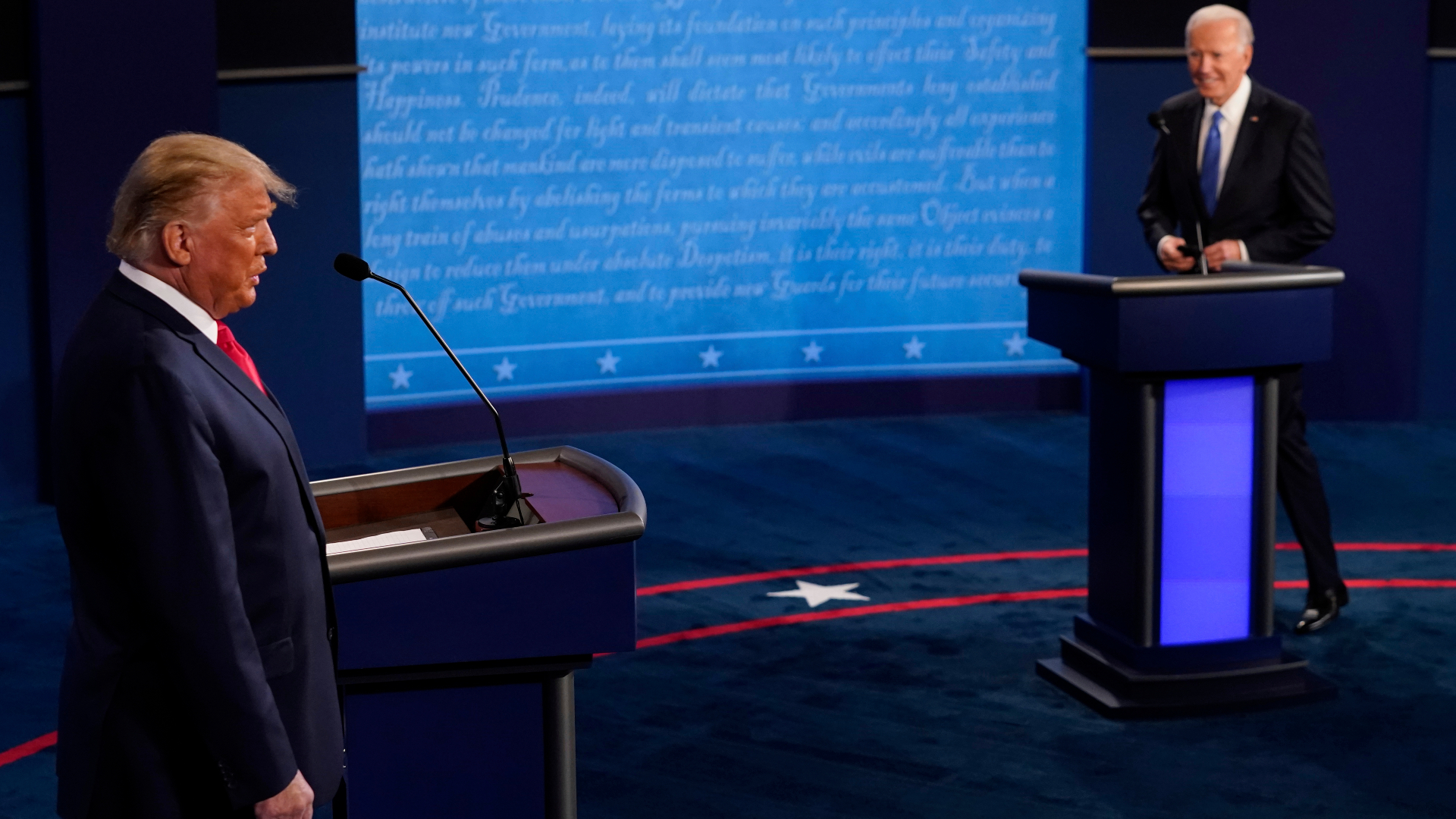 President Donald Trump and Democratic presidential candidate former Vice President Joe Biden walk on stage during the second and final presidential debate at Belmont University in Nashville, Tennessee, on Oct. 22, 2020. (Morry Gash / Associated Press)