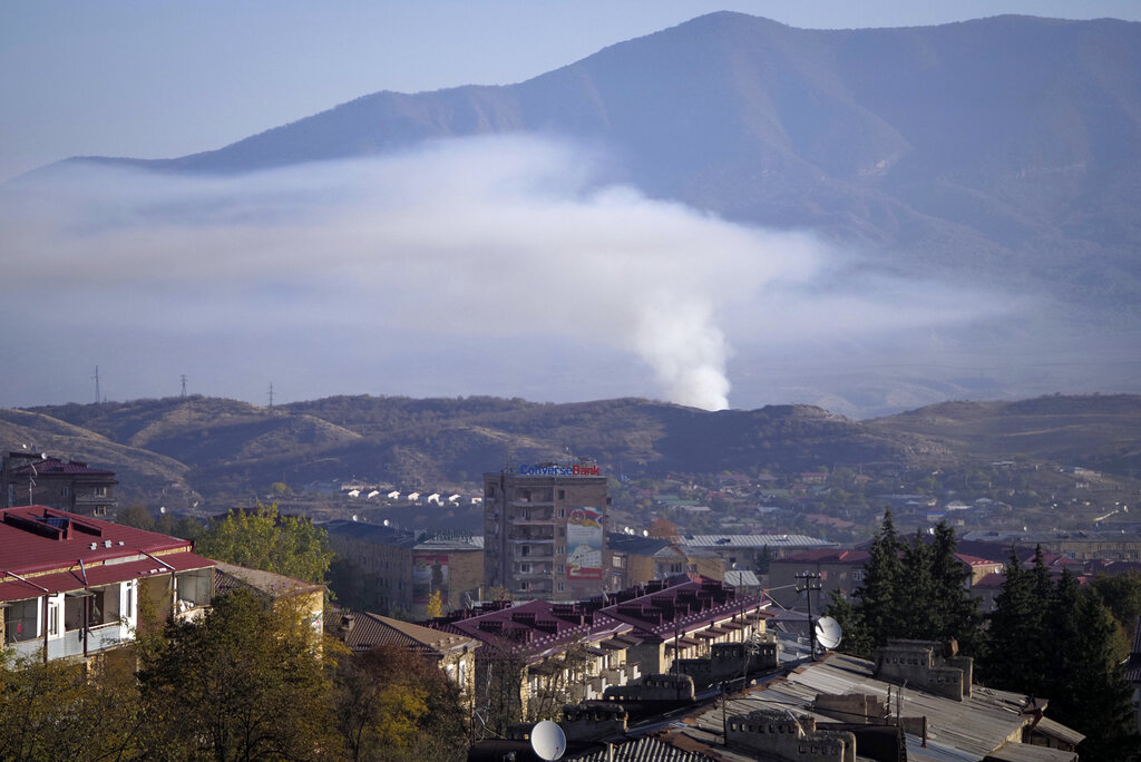 Smoke rises after shelling by Azerbaijan's artillery during a military conflict in Stepanakert, the separatist region of Nagorno-Karabakh on Oct. 24, 2020. (AP Photo)