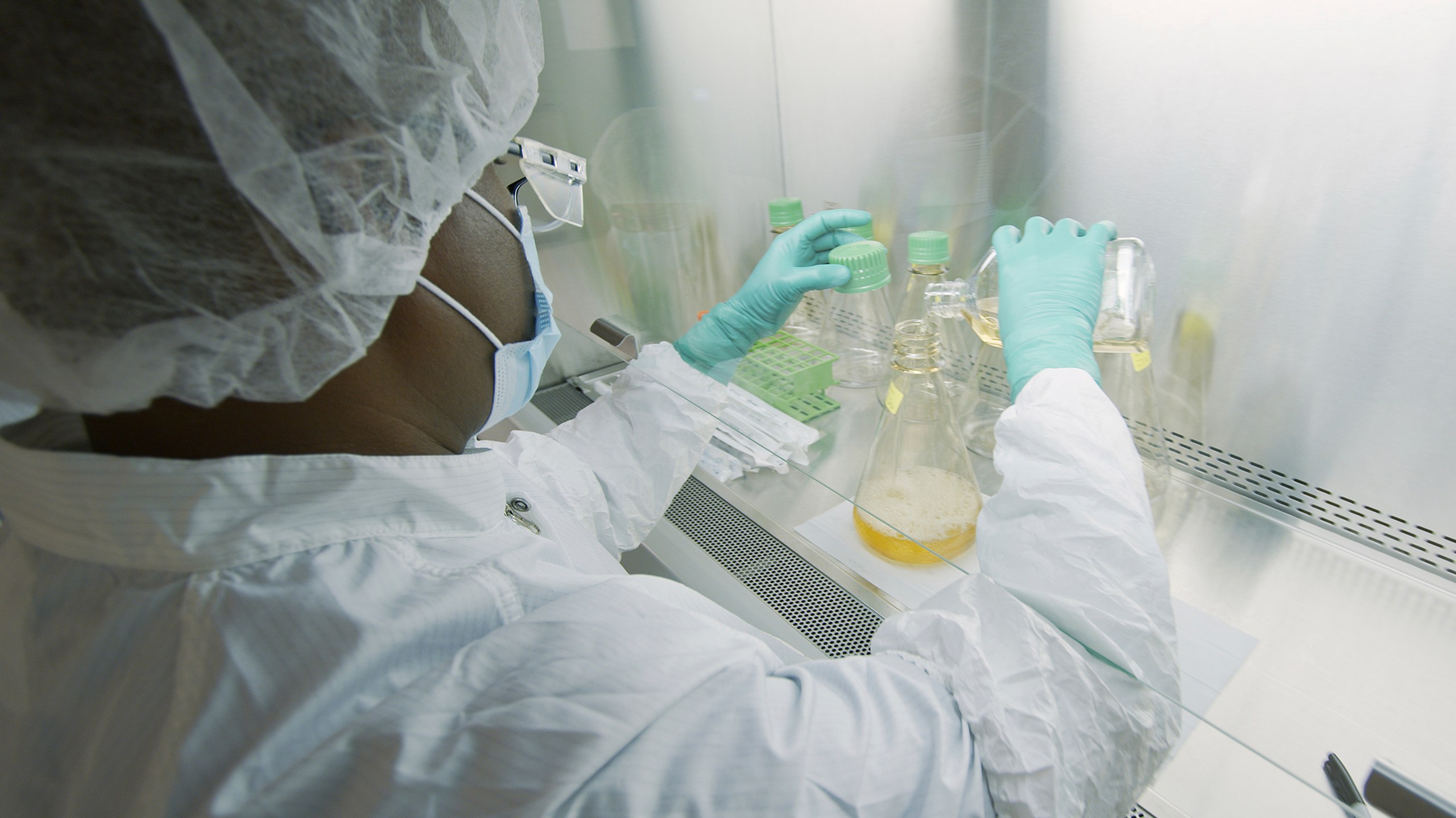 In this May 2020 file photo provided by Eli Lilly, a researcher tests possible COVID-19 antibodies in a laboratory in Indianapolis. (David Morrison/Eli Lilly via AP)