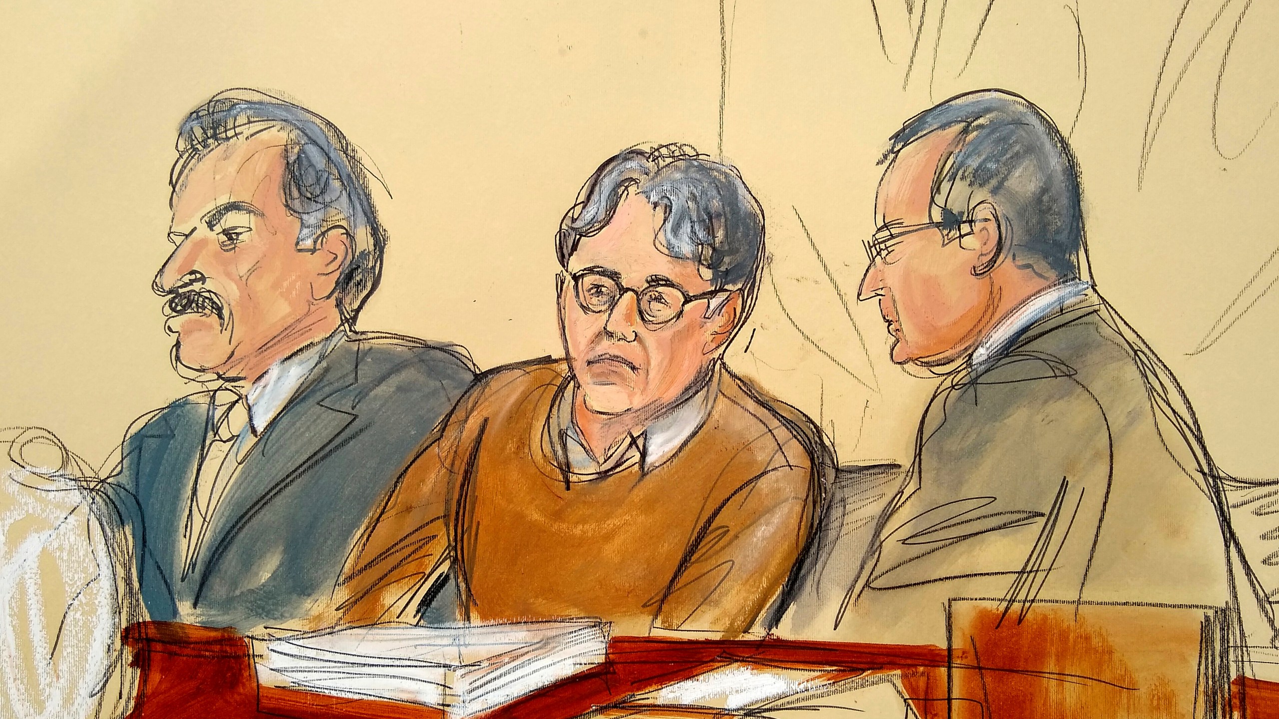 In this Tuesday, May 7, 2019, file courtroom drawing, defendant Keith Raniere, center, leader of the secretive group NXIVM, is seated between his attorneys Paul DerOhannesian, left, and Marc Agnifilo during the first day of his sex trafficking trial. Raniere, a self-improvement guru whose organization NXIVM attracted millionaires and actresses among its adherents was sentenced to 120 years in prison on Oct. 27, 2020.(Elizabeth Williams via Associated Press)