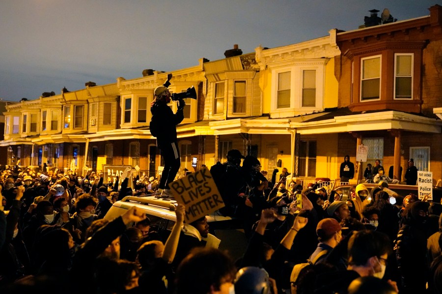 Protesters confront police during a march Tuesday Oct. 27, 2020 in Philadelphia. (AP Photo/Matt Slocum)