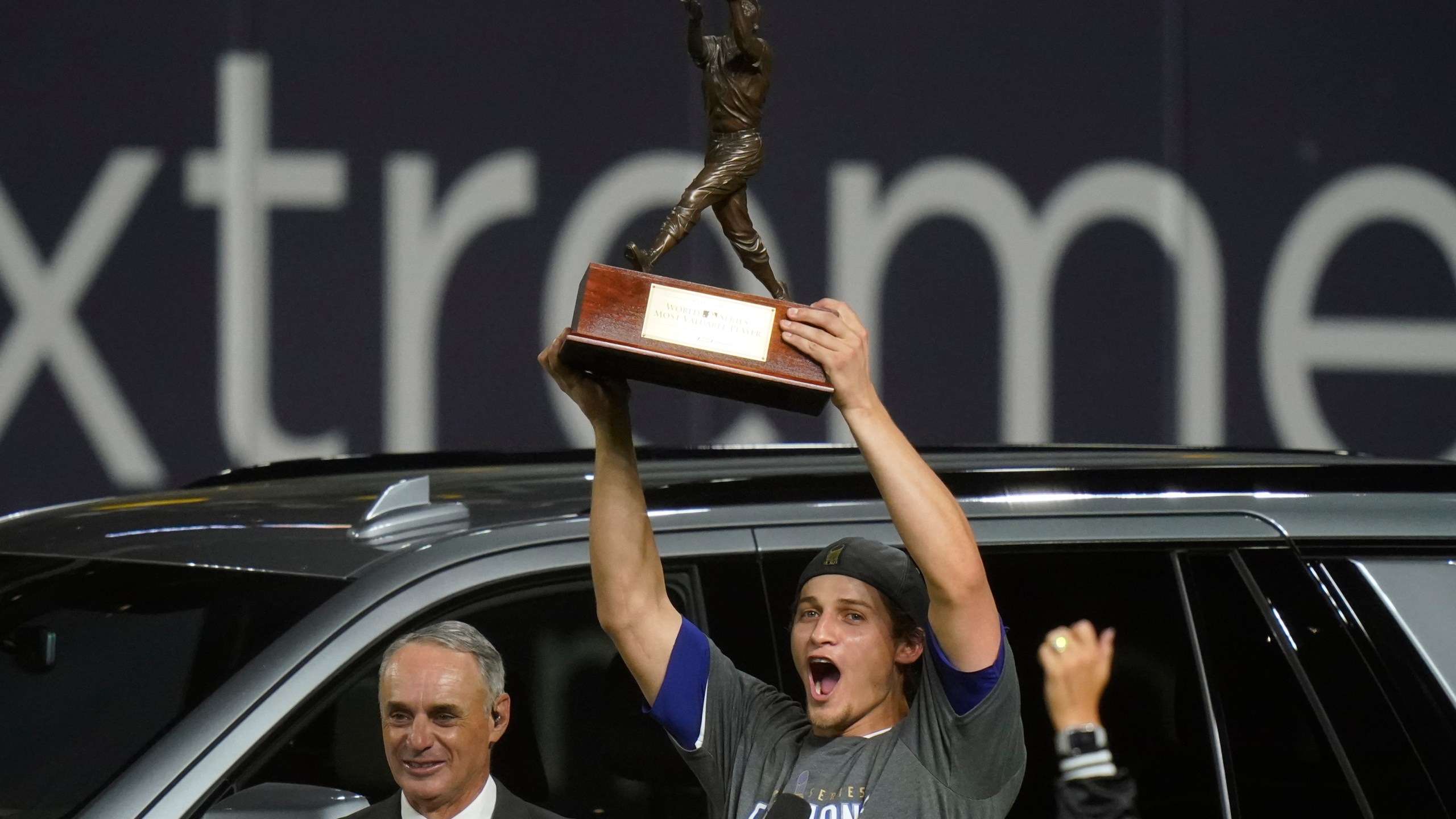 Los Angeles Dodgers shortstop Corey Seager holds up the MVP trophy after defeating the Tampa Bay Rays 3-1 to win the baseball World Series in Game 6 on Oct. 27, 2020, in Arlington, Texas. (AP Photo/Eric Gay)