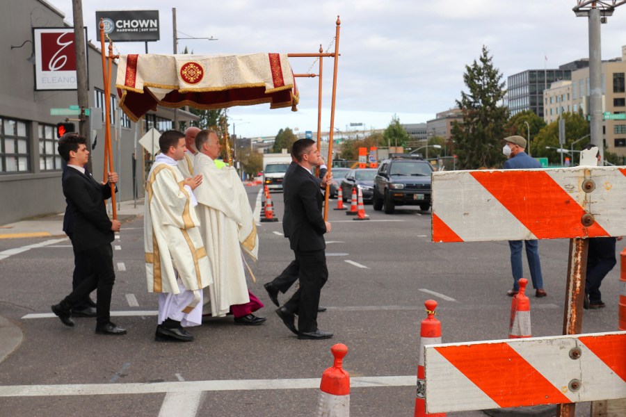 Archbishop Alexander Sample carries the Eucharist into downtown Portland, Ore., for an exorcism and rosary to bring peace and justice to the city on Oct. 17, 2020. (Ed Langlois/Catholic Sentinel via AP)