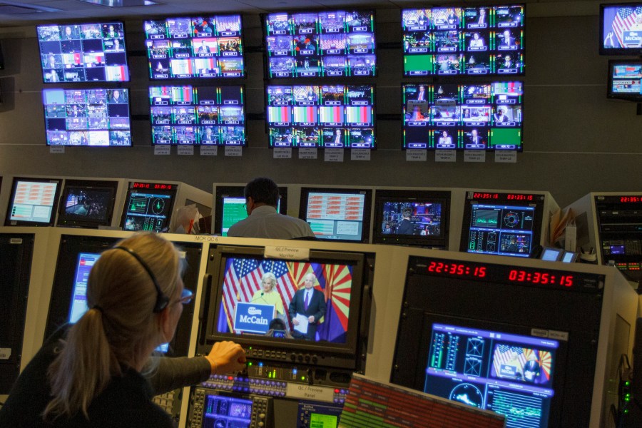 In this Nov. 8, 2016, photo, staff members of The Associated Press Television Network work in master control at the organization's Washington bureau as returns come in during election night. (Jon Elswick / Associated Press)