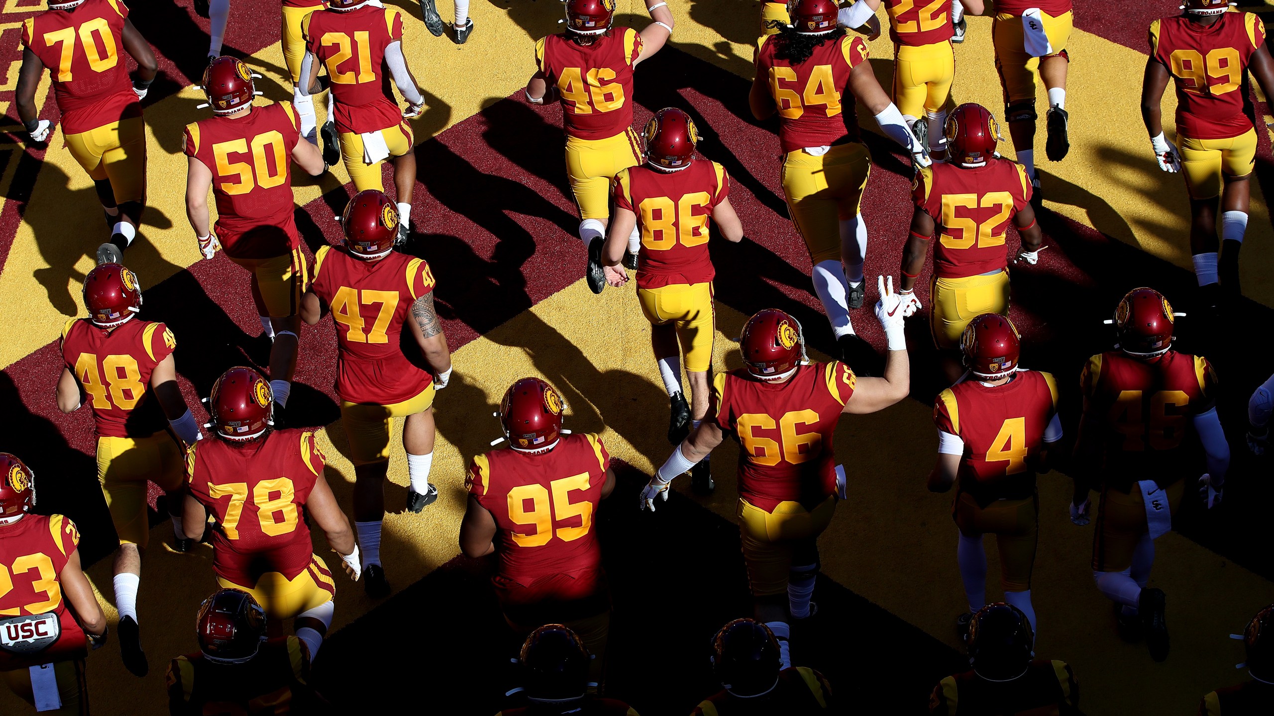 The USC Trojans run onto the field prior to a game against the UCLA Bruins at Los Angeles Memorial Coliseum on Nov. 23, 2019, in Los Angeles. (Sean M. Haffey/Getty Images)