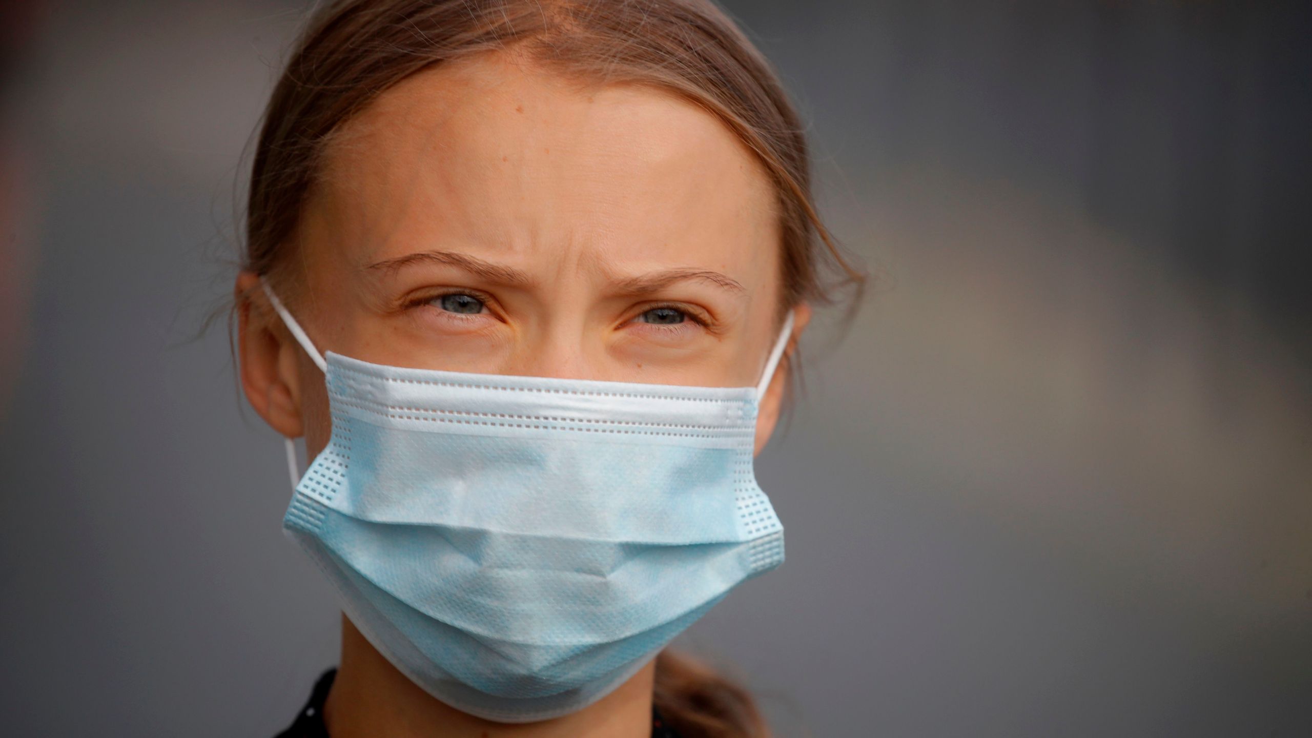 Greta Thunberg wears a face mask as she walks to the Chancellery, where she was to meet the German Chancellor for talks on Aug. 20, 2020. (ODD ANDERSEN/AFP via Getty Images)