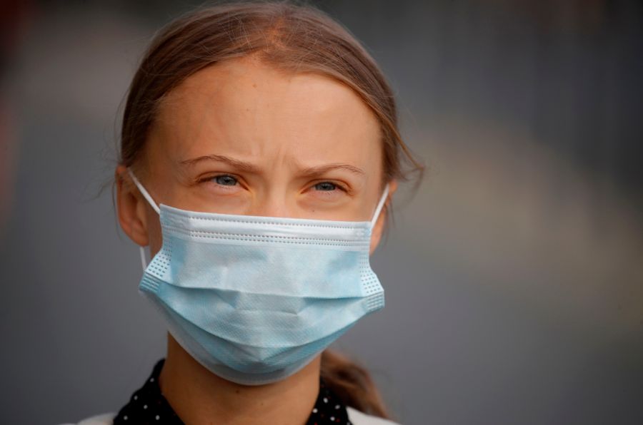 Greta Thunberg wears a face mask as she walks to the Chancellery, where she was to meet the German Chancellor for talks on Aug. 20, 2020. (ODD ANDERSEN/AFP via Getty Images)