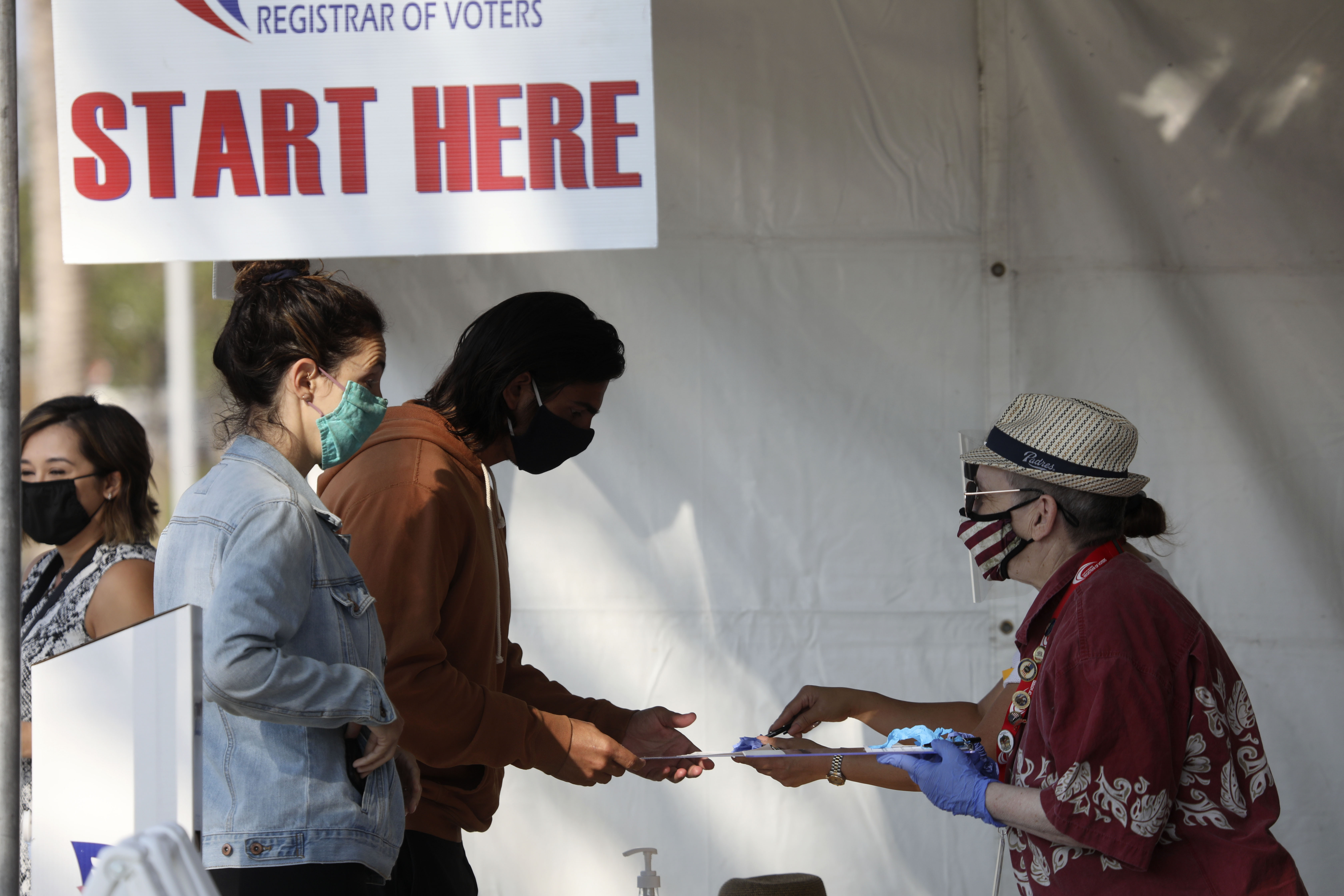 Voters line up to cast their ballots at the San Diego County Registrar of Voters on Oct. 5, 2020 in San Diego as early voting begins in California. (SANDY HUFFAKER/AFP via Getty Images)