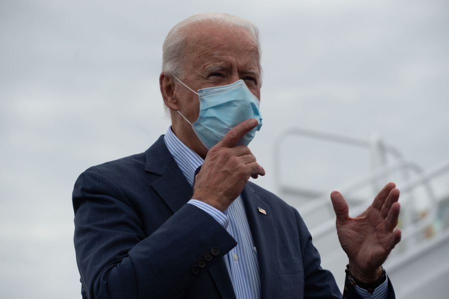 Democratic presidential candidate Joe Biden speaks to the press as he arrives at New Castle Airport in Wilmington, Delaware, on Oct. 10, 2020. (ROBERTO SCHMIDT/AFP via Getty Images)