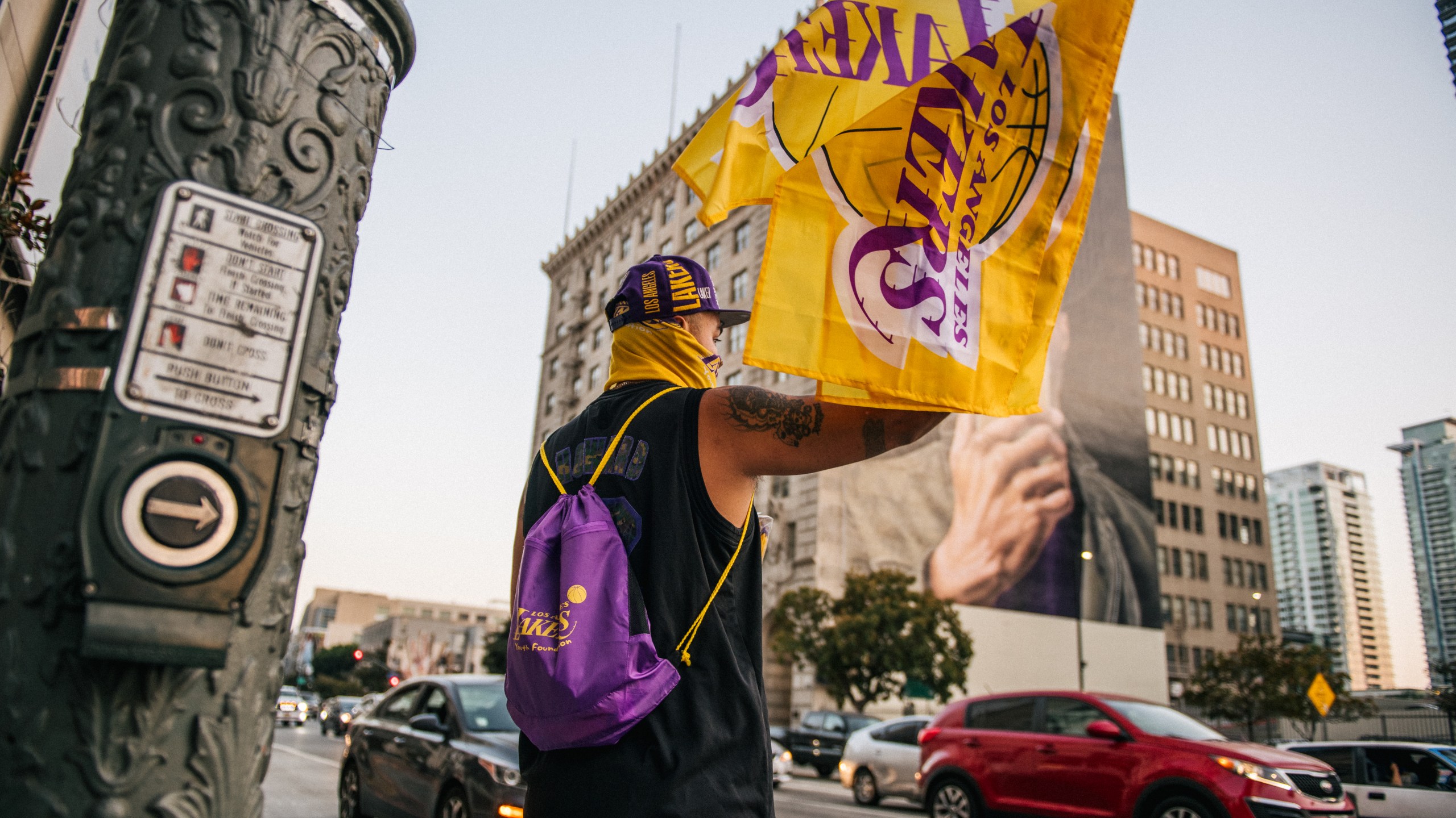 A man sells Lakers merchandise outside of the Staples Center on Oct. 11, 2020 in Los Angeles. (Brandon Bell/Getty Images)