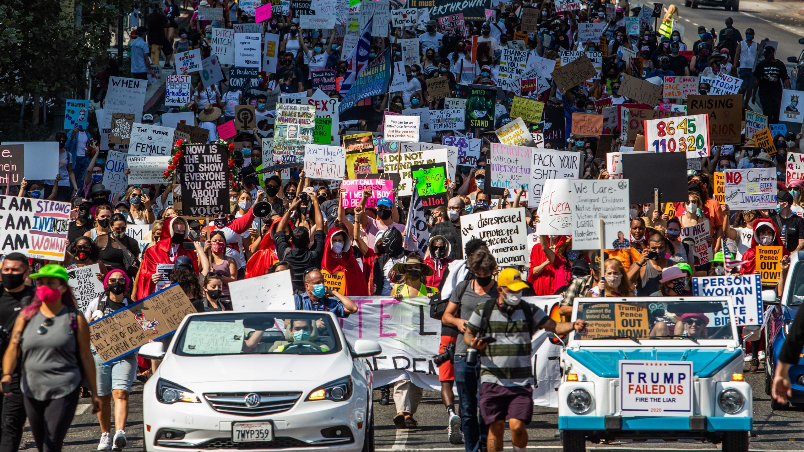 Demonstrate make their way through Los Angeles for the Women's March on Oct. 17, 2020. (APU GOMES/AFP via Getty Images)