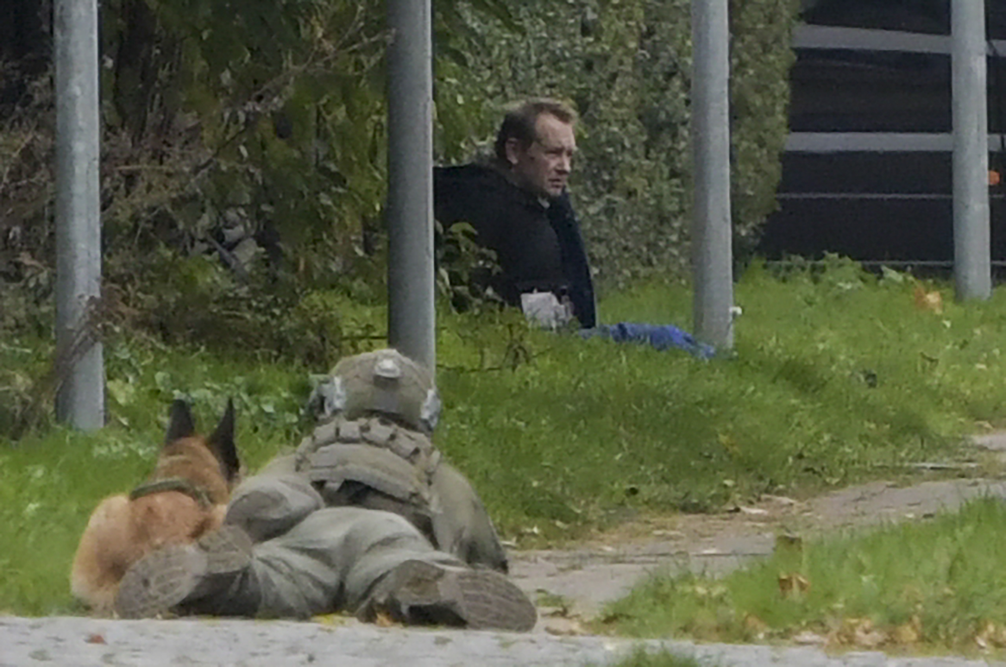 A police marksman and his dog observes convicted killer Peter Madsen threatening police with detonating a bomb while attempting to break out of jail in Albertslund, Denmark on Oct. 20, 2020. (NILS MEILVANG/Ritzau Scanpix/AFP via Getty Images)