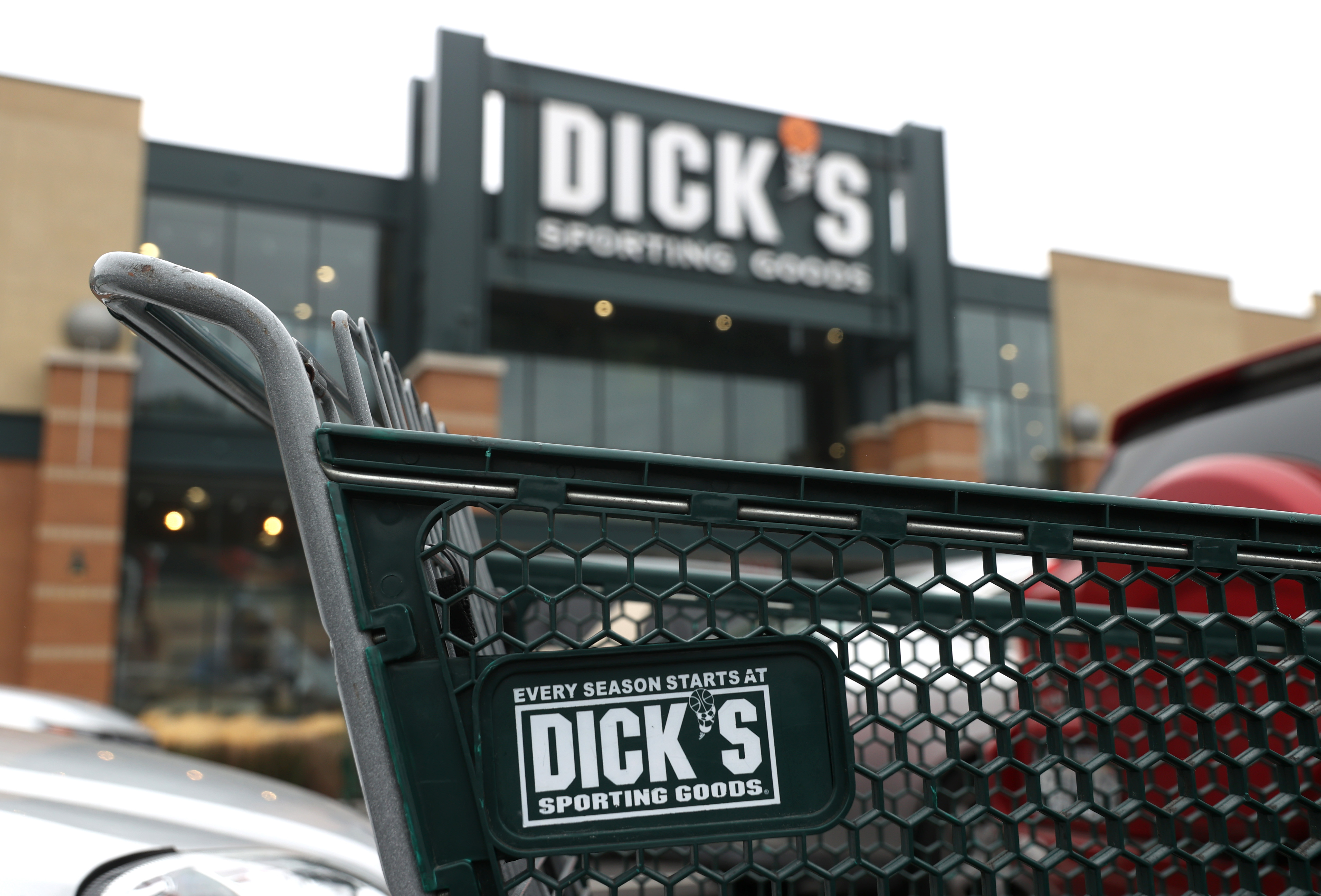 A shopping cart sits in front of a Dick's Sporting Goods store on Aug. 26, 2020. in Daly City, California. (Justin Sullivan/Getty Images)