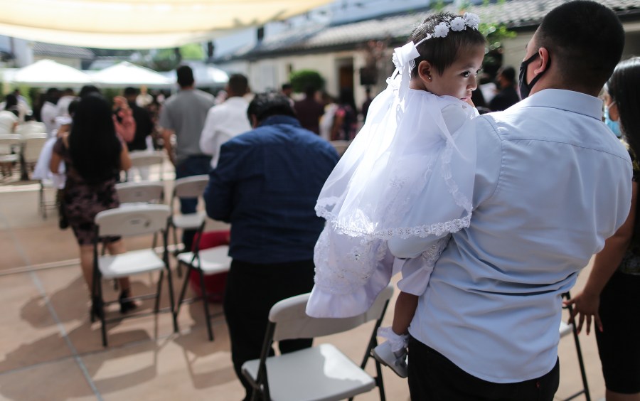 Worshippers gather for a baptism on Sept. 26, 2020 in Los Angeles, California. (Mario Tama/Getty Images)