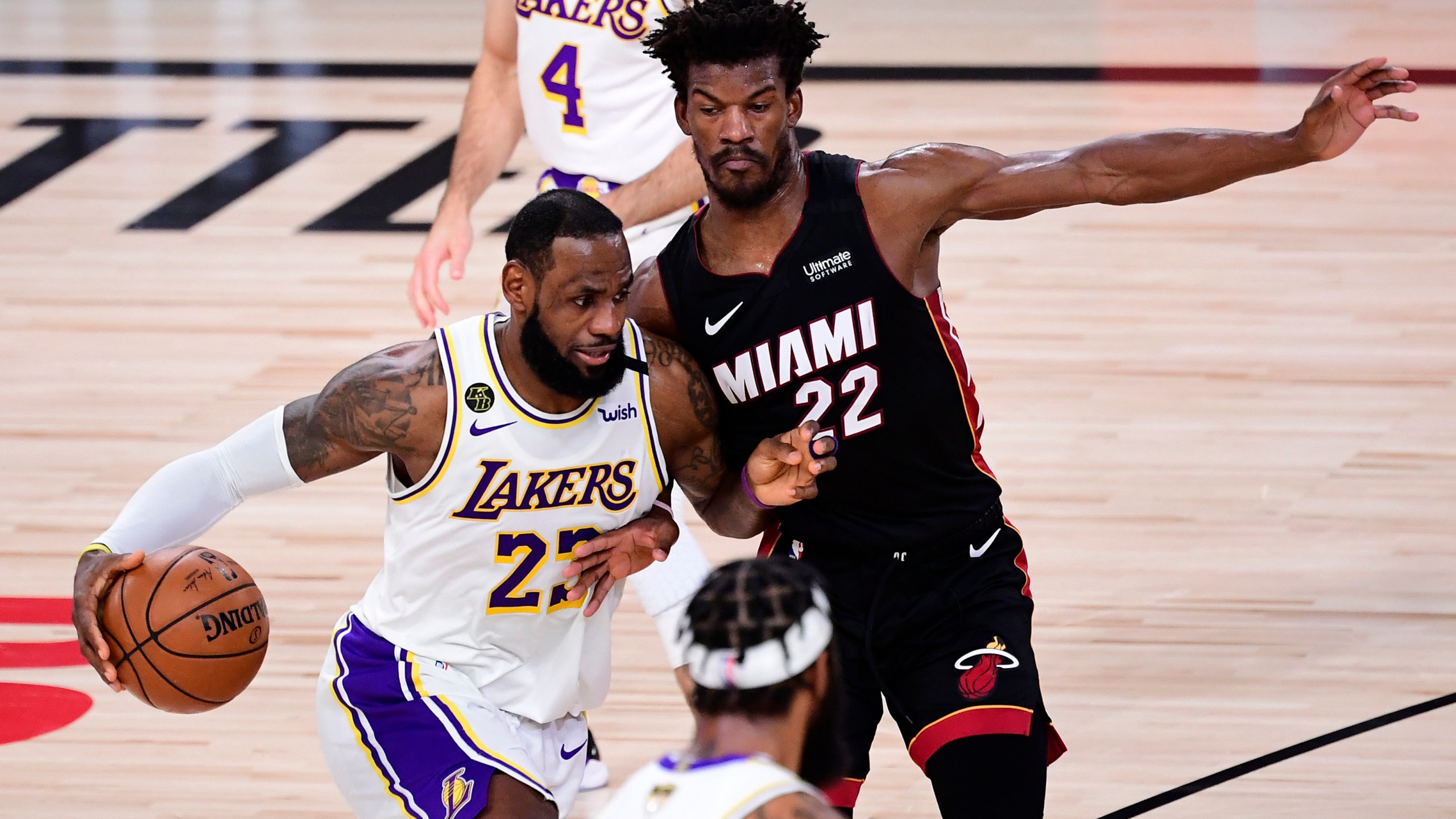 LeBron James of the Los Angeles Lakers drives to the basket against Jimmy Butler of the Miami Heat during Game 3 of the 2020 NBA Finals at AdventHealth Arena at ESPN Wide World of Sports Complex on Oct. 4, 2020 in Lake Buena Vista, Florida. (Douglas P. DeFelice/Getty Images)