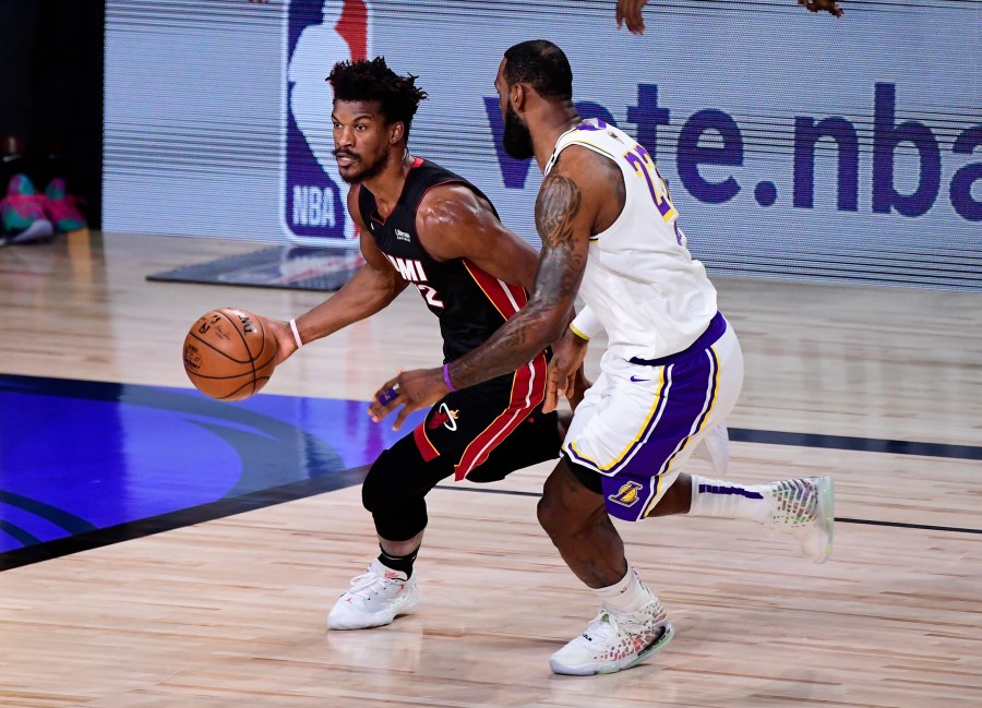 Jimmy Butler of the Miami Heat dribbles against LeBron James of the Los Angeles Lakers during the first half in Game 3 of the 2020 NBA Finals at AdventHealth Arena at ESPN Wide World Of Sports Complex on Oct. 4, 2020 in Lake Buena Vista, Florida. (Douglas P. DeFelice/Getty Images)