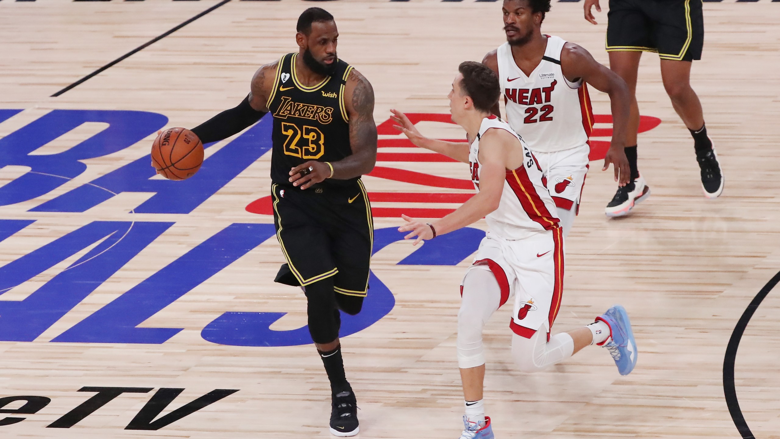 LeBron James of the Los Angeles Lakers drives the ball against Duncan Robinson of the Miami Heat in Game Five of the 2020 NBA Finals at AdventHealth Arena in Lake Buena Vista, Florida on Oct. 9, 2020. (Sam Greenwood / Getty Images)