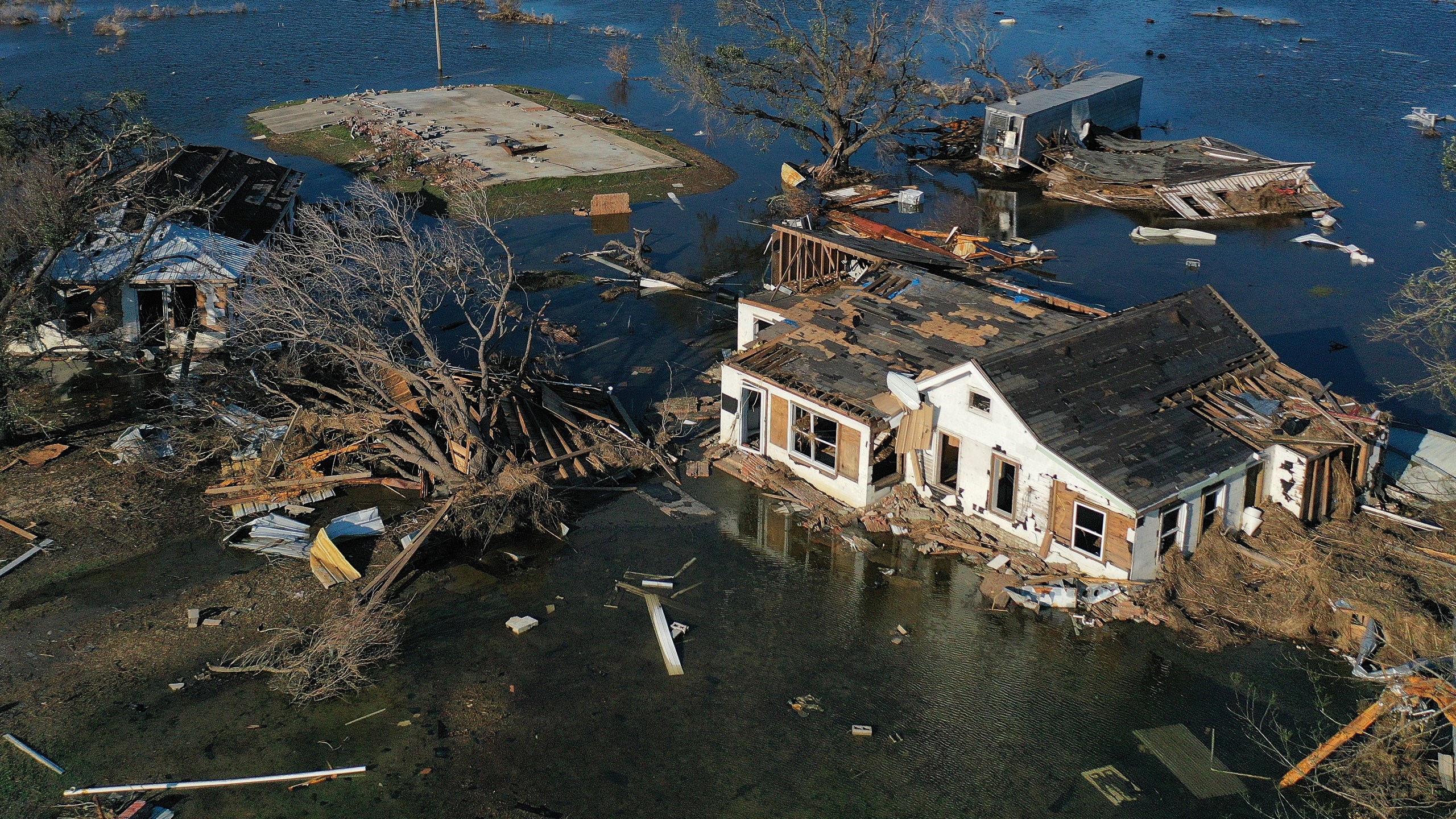 An aerial view of floodwaters from Hurricane Delta surrounding structures destroyed by Hurricane Laura on Oct. 10, 2020, in Creole, Louisiana. Hurricane Delta made landfall near Creole as a Category 2 storm in Louisiana, initially leaving some 300,000 customers without power. (Mario Tama/Getty Images)