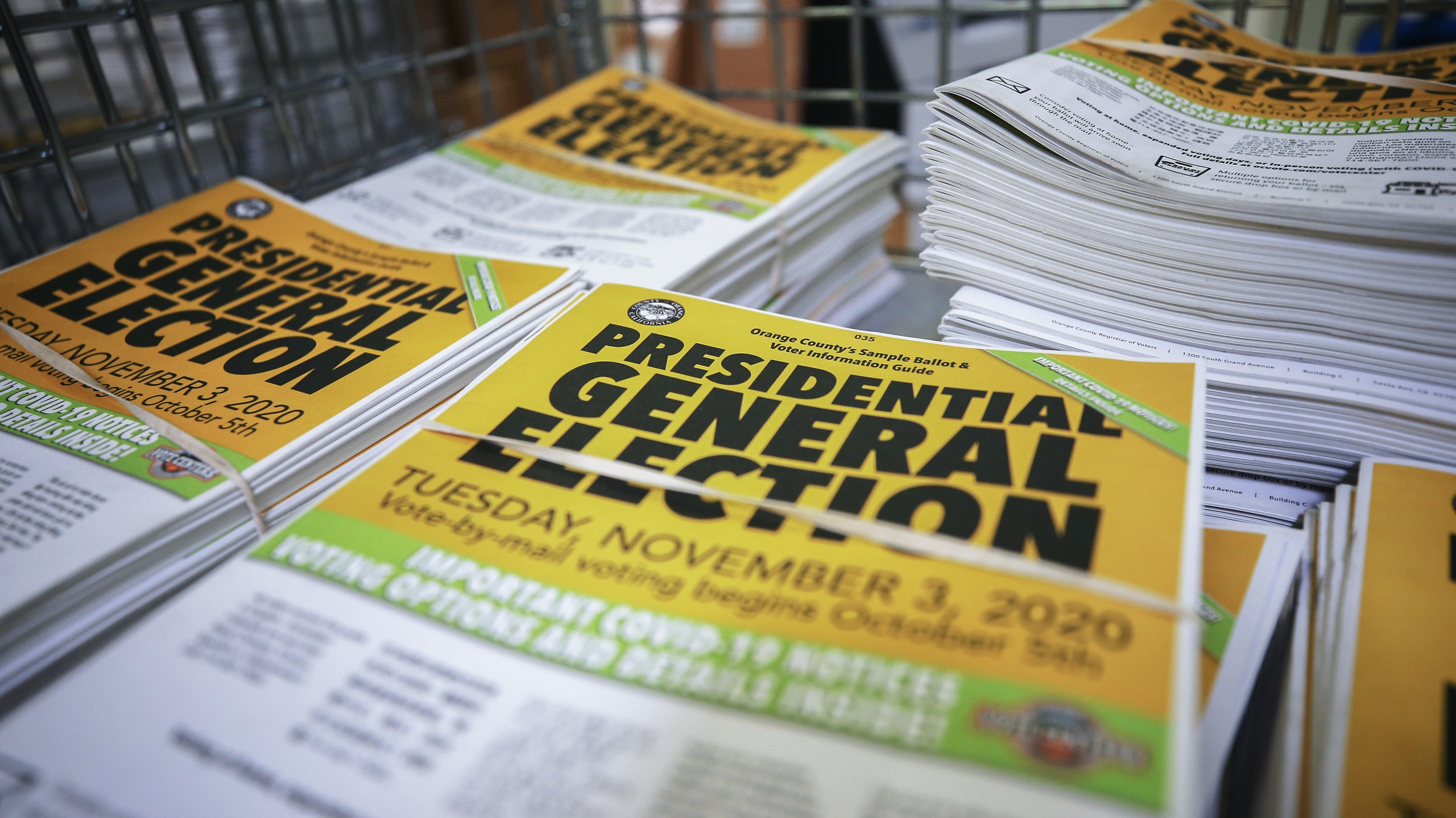 Voter information guides sit bundled at the Orange County Registrar of Voters on Oct. 19, 2020, in Santa Ana. (Mario Tama/Getty Images)