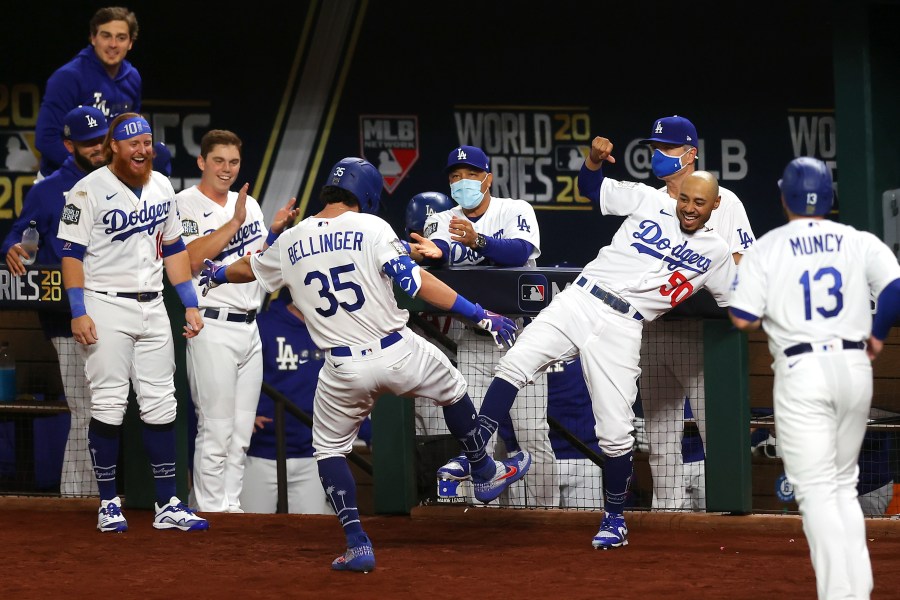 Cody Bellinger of the Los Angeles Dodgers is congratulated by Mookie Betts after hitting a two-run home run against the Tampa Bay Rays during Game One of the World Series in Arlington, Texas, on Oct. 20, 2020. (Ronald Martinez / Getty Images)