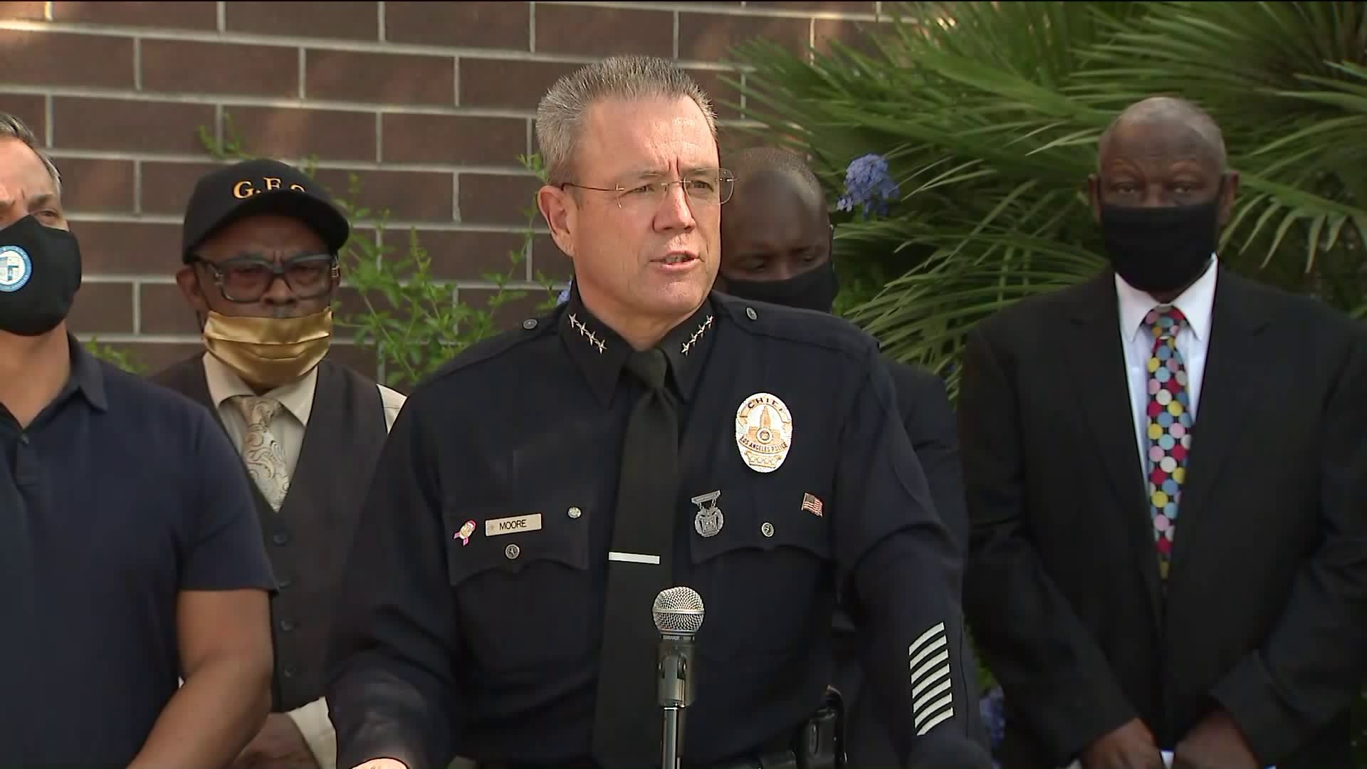 LAPD Chief Michel Moore speaks at a news conference.