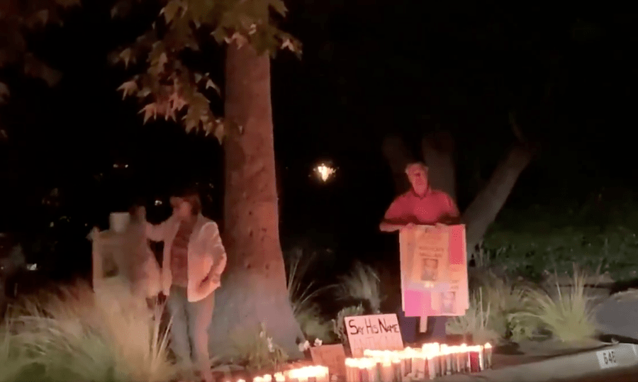 Video posted to Twitter appears to show the mayor of Pasadena removing signs from a vigil for Anthony McClain on Oct. 24, 2020. (Sean Carmitchel)