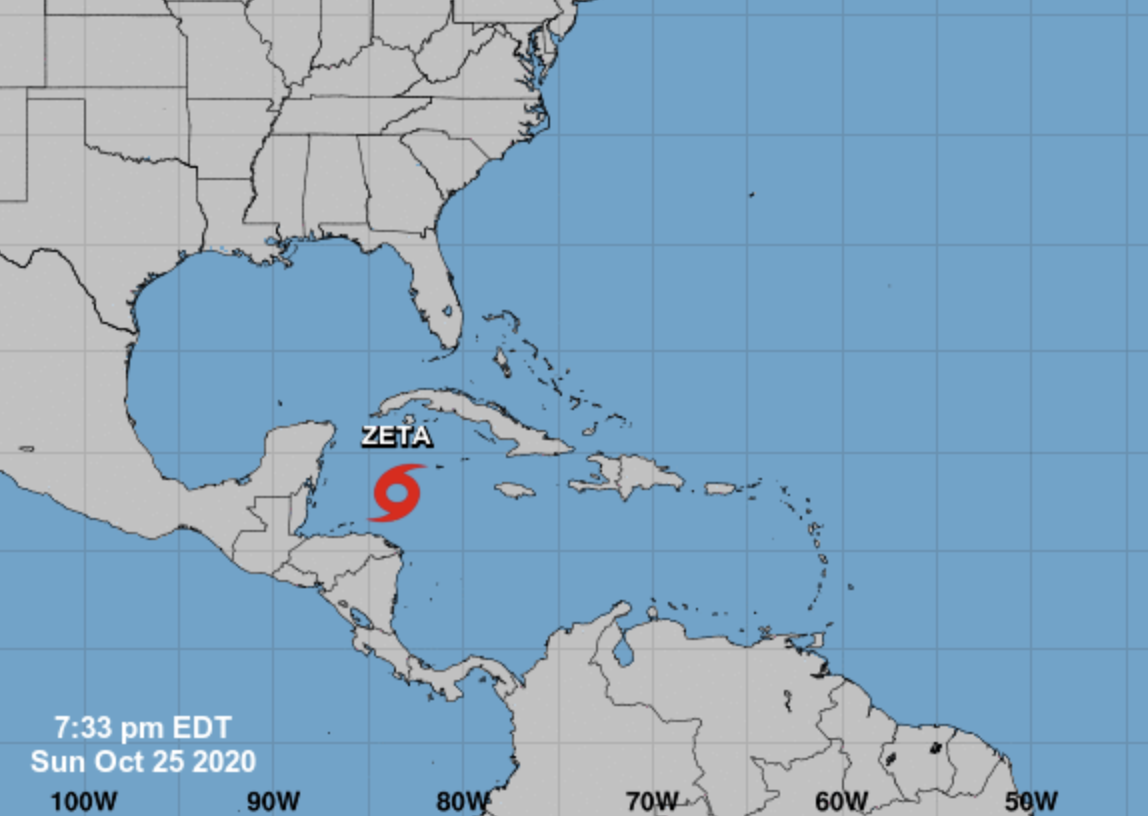 This image from the National Hurricane Center, updated as of Sunday evening Oct. 25, 2020, shows the current location of Tropical Storm Zeta as it strengthens into a hurricane while moving toward the Gulf Coast.