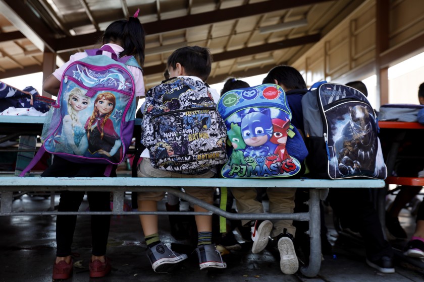 Students sit at tables after school at Telfair Elementary in Pacoima, which serves a high percentage of homeless students. (Francine Orr / Los Angeles Times)