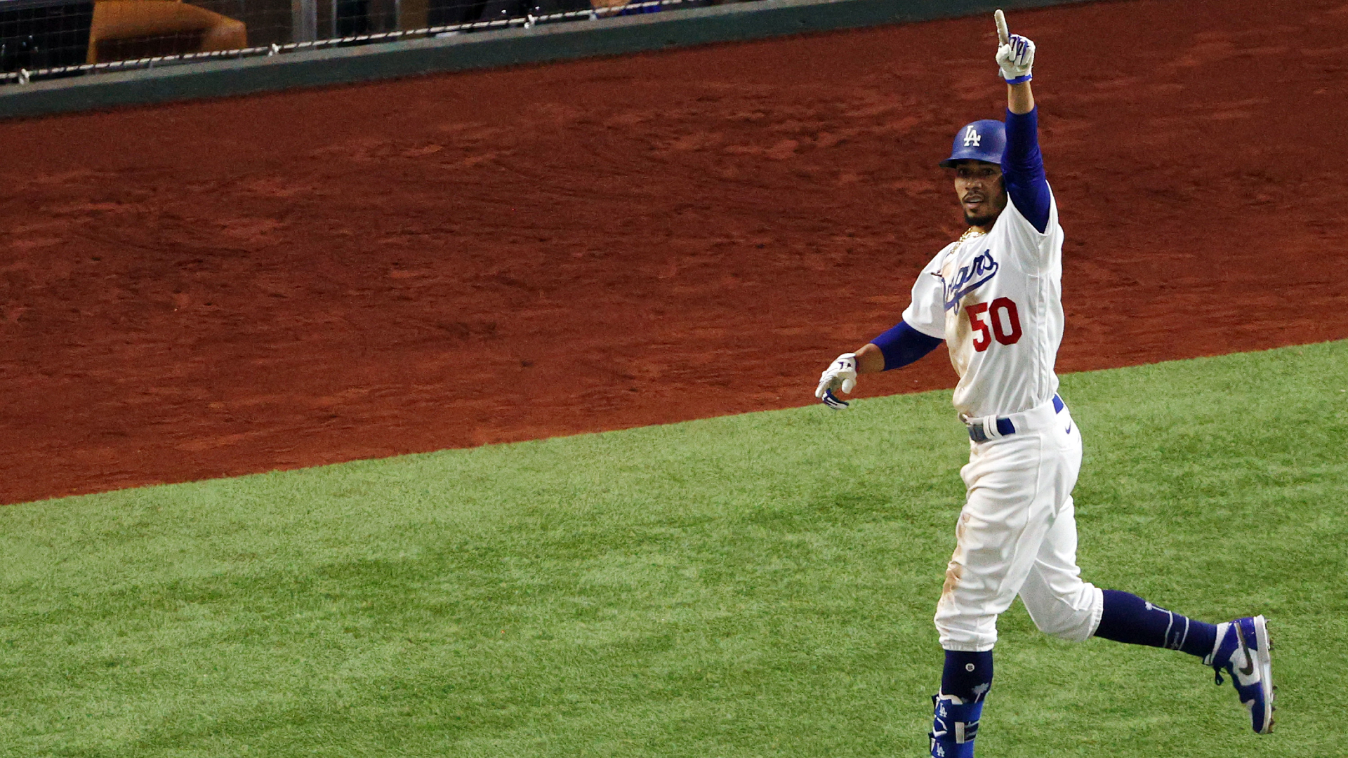 Mookie Betts of the Los Angeles Dodgers celebrates after hitting a solo home run against the Tampa Bay Rays during Game One of the World Series in Arlington, Texas, on Oct. 20, 2020. (Sean M. Haffey / Getty Images)