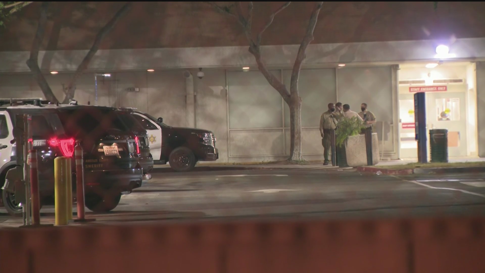 Deputies stand outside the Harbor-UCLA Medical Center in West Carson on Oct. 6, 2020 after an officer shot a psychiatric patient inside. (KTLA)