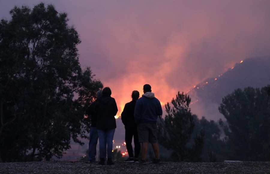 People watch the Blue Ridge fire burn on Foxtail Drive in Yorba Linda on Oct. 26, 2020. (Myung J. Chun/Los Angeles Times)