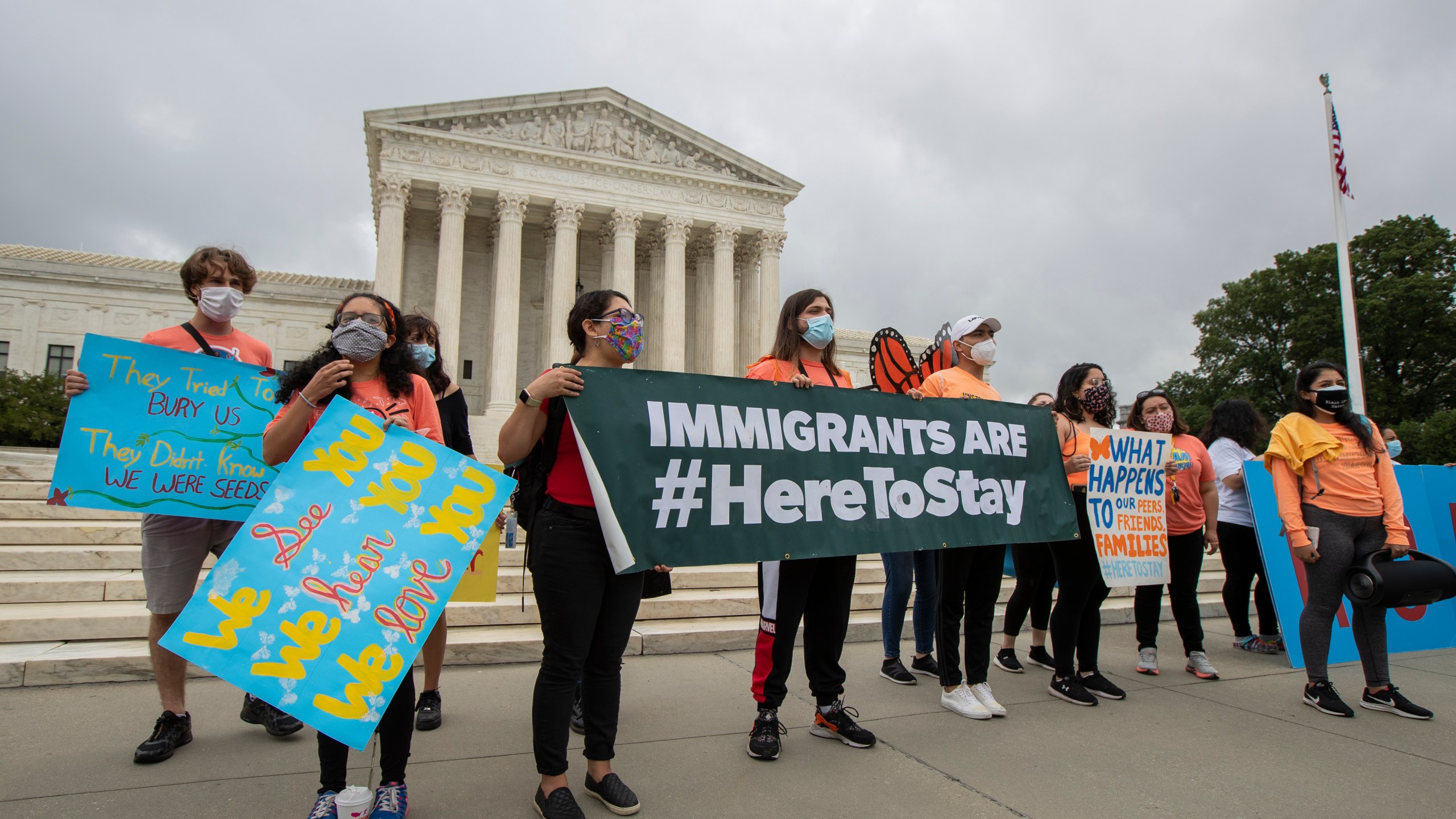 In this June 18, 2020, photo, Deferred Action for Childhood Arrivals (DACA) students celebrate in front of the Supreme Court after the Supreme Court rejected President Donald Trump's effort to end legal protections for young immigrants. (Manuel Balce Ceneta / Associated Press)