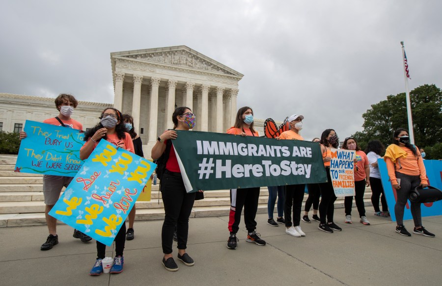 In this June 18, 2020, photo, Deferred Action for Childhood Arrivals (DACA) students celebrate in front of the Supreme Court after the Supreme Court rejected President Donald Trump's effort to end legal protections for young immigrants. (Manuel Balce Ceneta / Associated Press)