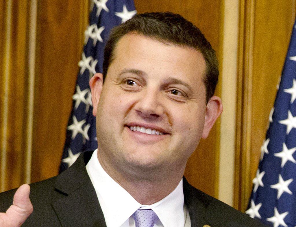 In this Jan. 6, 2015, file photo, Rep. David Valadao, R-Calif., poses during a ceremonial re-enactment of his swearing-in ceremony in the Rayburn Room on Capitol Hill in Washington. (AP Photo/Jacquelyn Martin, File)