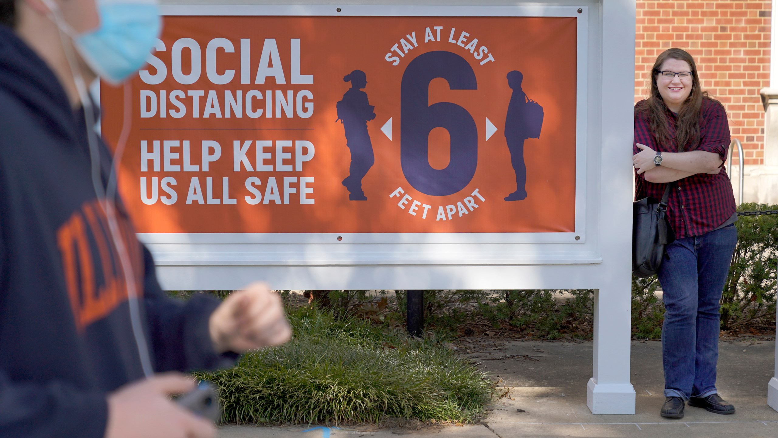 University of Illinois student Sarah Keeley, right, poses for a portrait on the college campus in Urbana, Ill., on Oct. 6, 2020. (AP Photo/Charles Rex Arbogast)