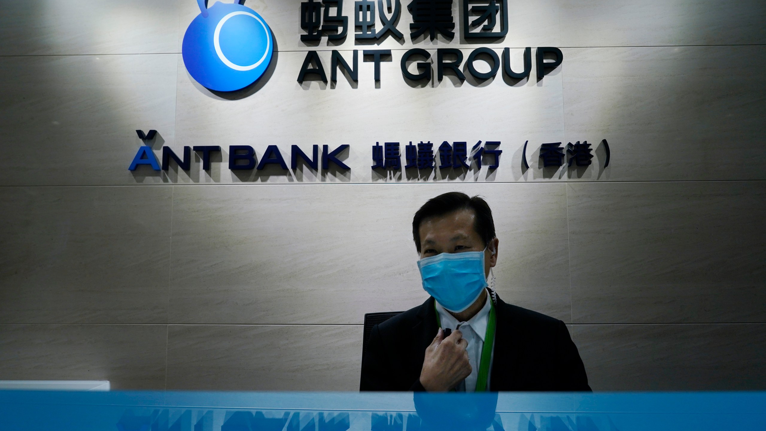 In this Friday, Oct. 23, 2020, photo, an employee sits at the Ant Group office in Hong Kong. (Kin Cheung/AP Photo)