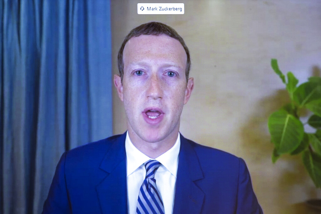 In this Oct. 28. 2020 file photo, Facebook CEO of Mark Zuckerberg appears on a screen as he speaks remotely during a hearing before the Senate Commerce Committee on Capitol Hill in Washington. (Michael Reynolds/Pool via AP)