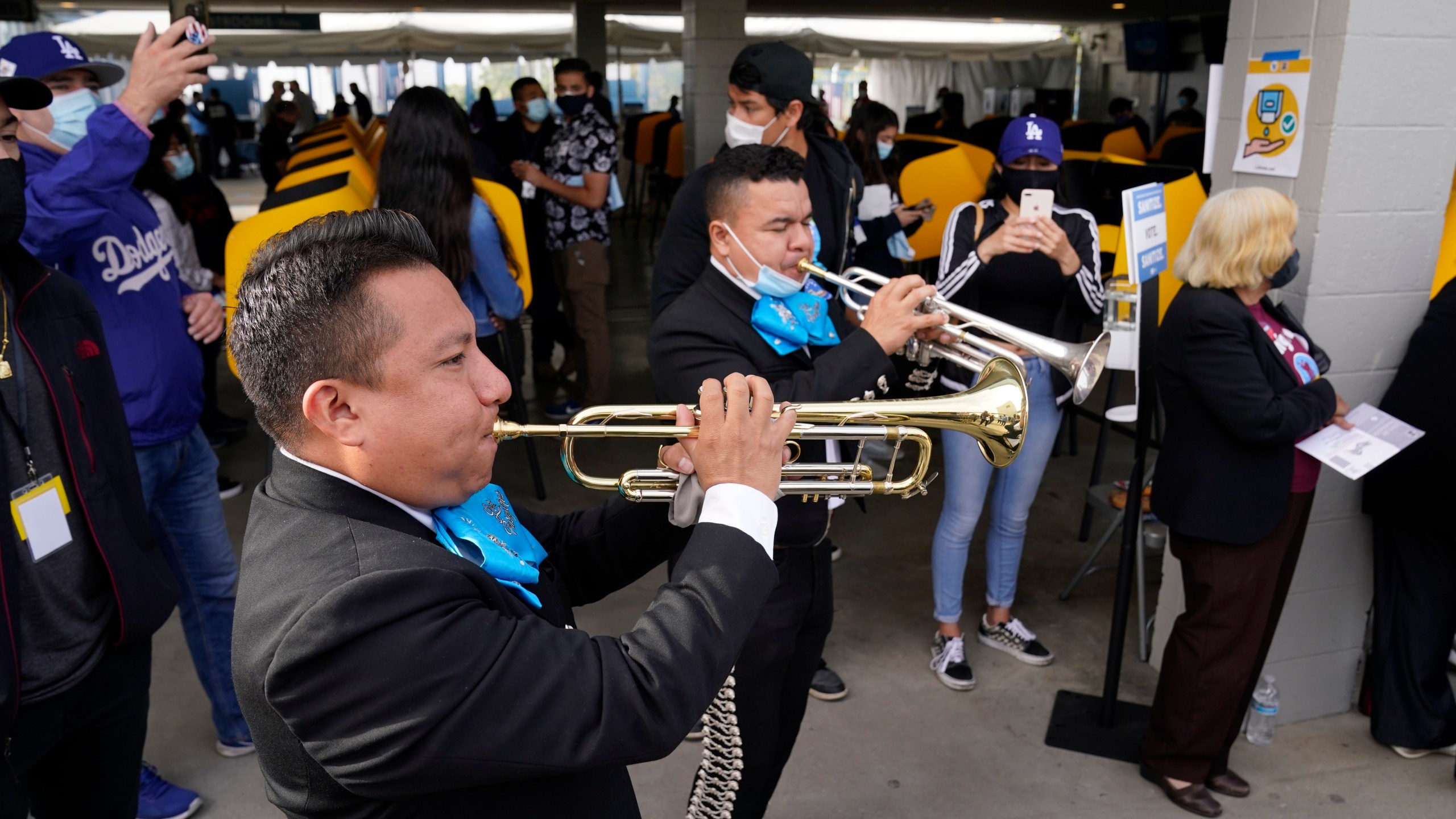 Members of Los Pasajeros mariachi band play for voters at a polling place at Dodger Stadium on Election Day, Tuesday, Nov. 3, 2020, in Los Angeles. (Chris Pizzello/AP Photo)