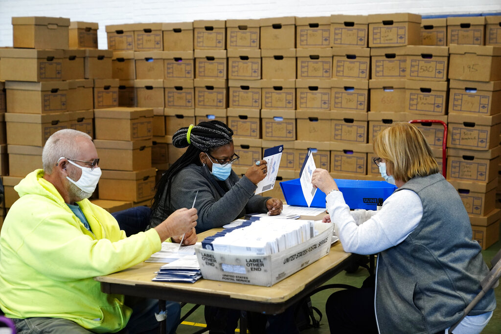 Chester County, Pa., election workers process mail-in and absentee ballots for the 2020 general election in the United States at West Chester University, Wednesday, Nov. 4, 2020, in West Chester., Pa. (AP Photo/Matt Slocum)