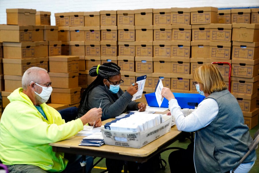 Chester County, Pa., election workers process mail-in and absentee ballots for the 2020 general election in the United States at West Chester University, Wednesday, Nov. 4, 2020, in West Chester., Pa. (AP Photo/Matt Slocum)