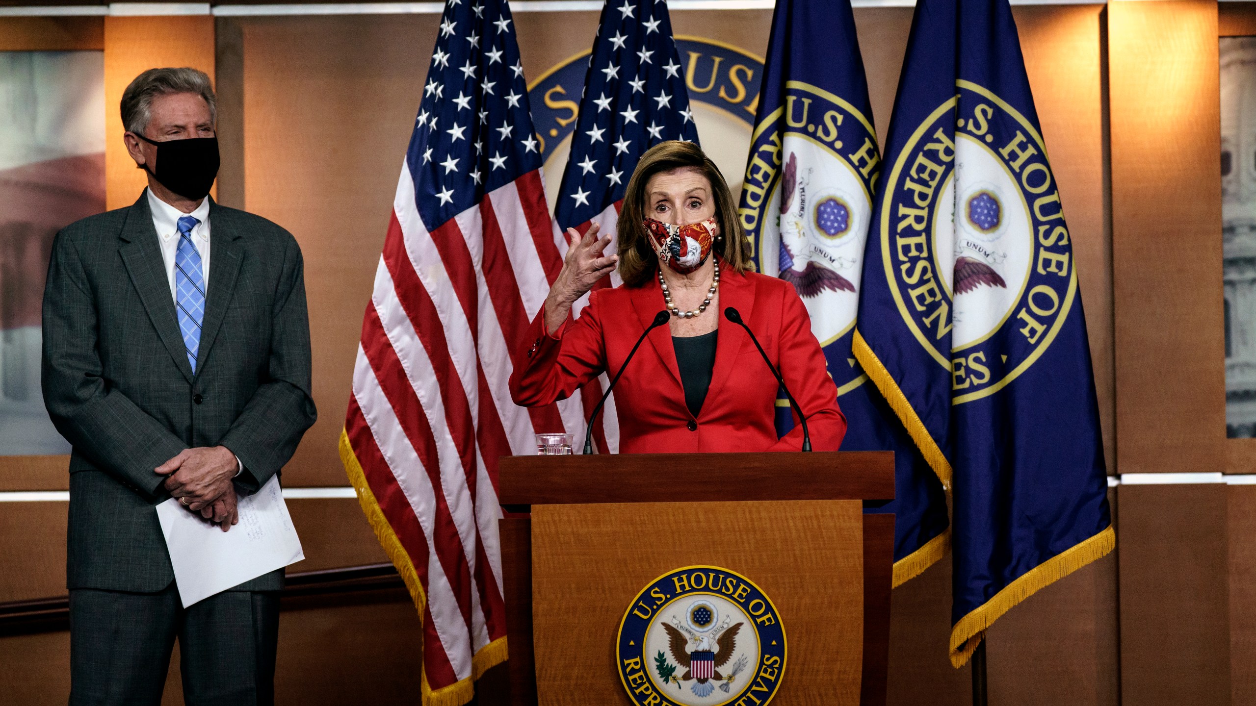 Speaker of the House Nancy Pelosi, D-Calif., talks to reporters about the impact of the election on the political landscape in Congress, at the Capitol in Washington, on Nov. 6, 2020. She is joined at left by House Energy and Commerce Chairman Frank Pallone, D-N.J. (J. Scott Applewhite / Associated Press)