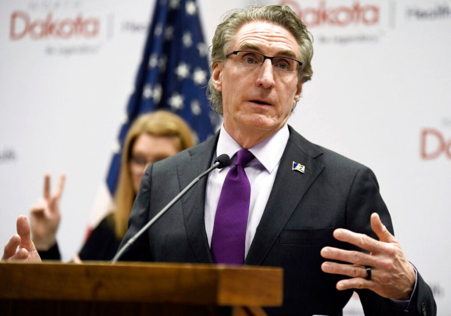 In this April 10, 2020, file photo, North Dakota Gov. Doug Burgum speaks at the state Capitol in Bismarck, N.D. North Dakota and South Dakota have the nation's worst rate of coronavirus deaths per capita in the last 30 days. Despite advances in treating coronavirus patients, hundreds more people in the Dakotas have died in recent weeks than during any other time of the pandemic. (Mike McCleary/The Bismarck Tribune via AP, File)