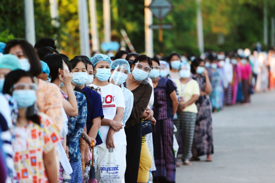 Voters line up to cast their ballots at a polling station Sunday, Nov. 8, 2020, in Naypyitaw, Myanmar. (Aung Shine Oo/AP Photo)