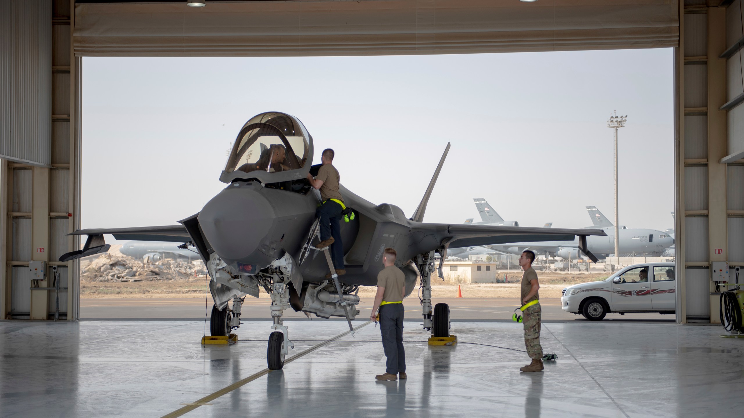 In this Aug. 5, 2019, photo released by the U.S. Air Force, an F-35 fighter jet pilot and crew prepare for a mission at Al-Dhafra Air Base in the United Arab Emirates. (Staff Sgt. Chris Thornbury/U.S. Air Force via AP)